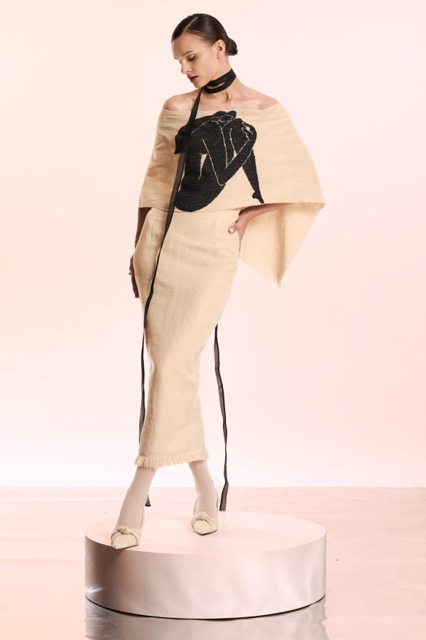 This dress has an elegant cape-effect overlay, beautifully hand embroidered with a black solhouette. It has fringes at the bottom and at the back.