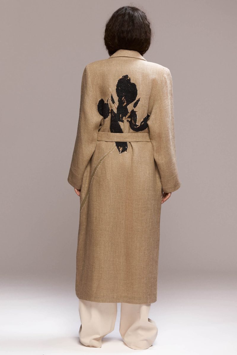 Crafted from hemp, this coat offers a lightweight yet sophisticated layer. It features a hand embroided lily on the back and and it has a unique and relaxed silhouette.