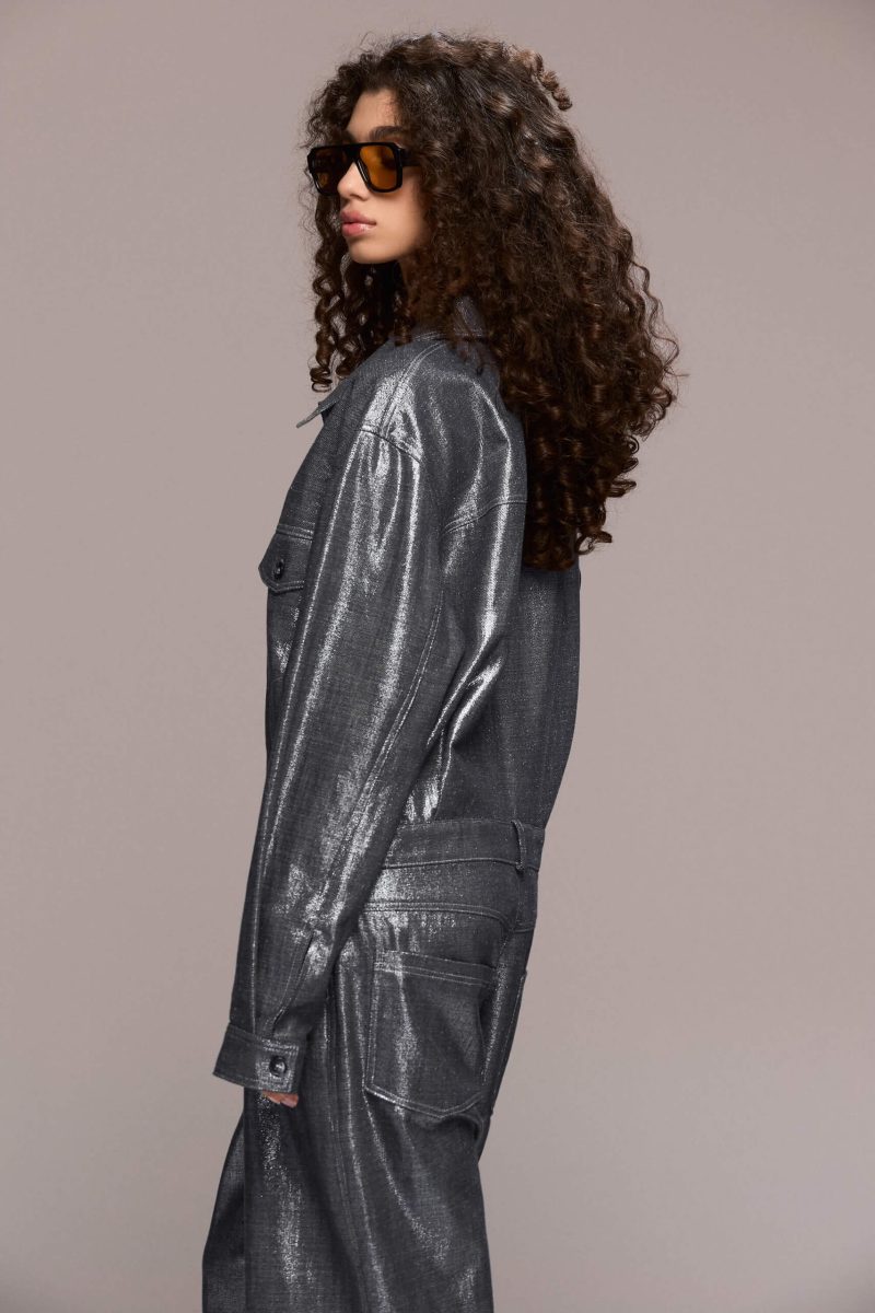 The silver metallic boilersuit offers a bold, fashion-forward statement. Its relaxed, oversized fit with a collared top and front button closure, straight-leg makes it perfect for a night out, a festival or any event where you want to stand out, being both eye-catching and comfortable.