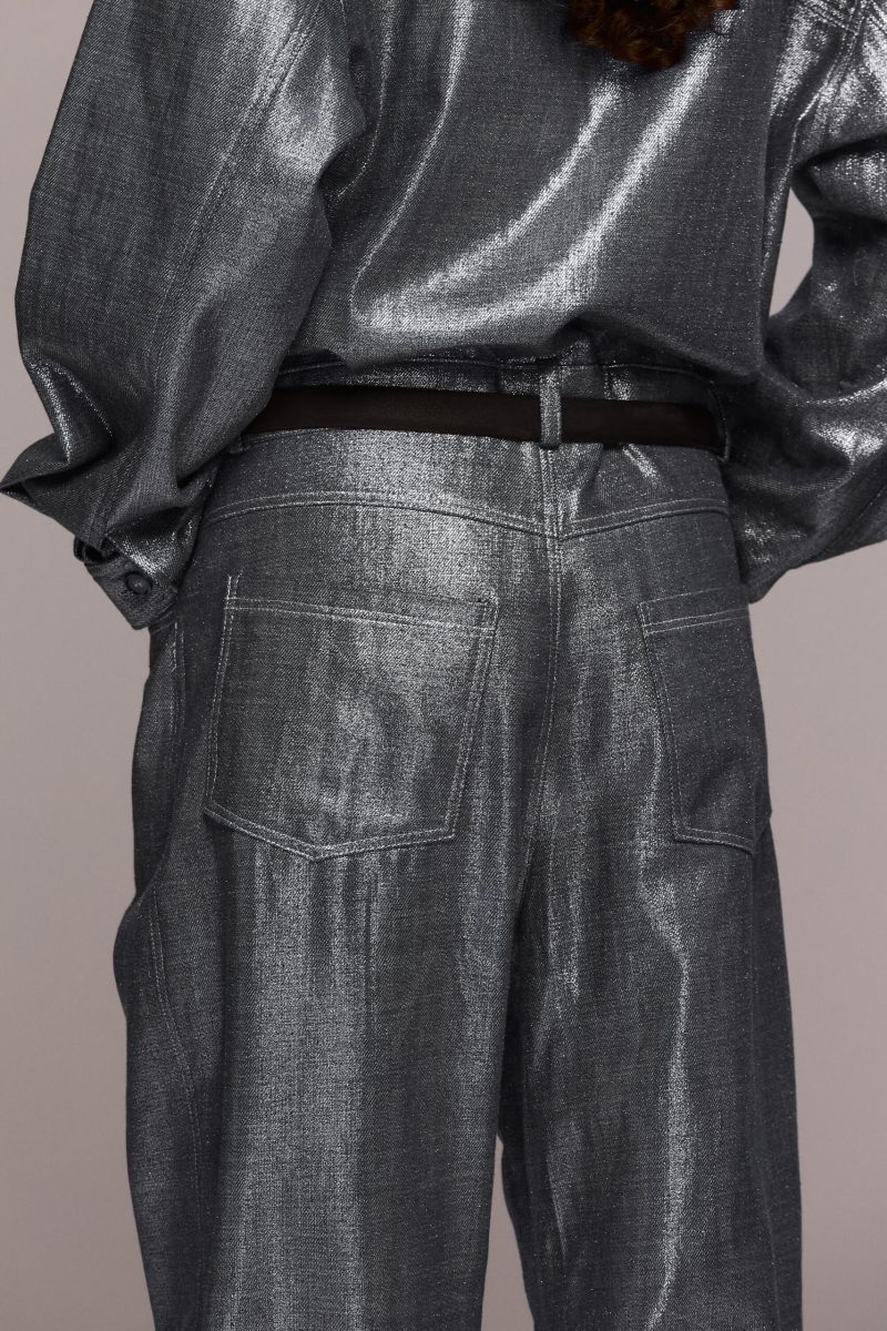 The silver metallic boilersuit offers a bold, fashion-forward statement. Its relaxed, oversized fit with a collared top and front button closure, straight-leg makes it perfect for a night out, a festival or any event where you want to stand out, being both eye-catching and comfortable.