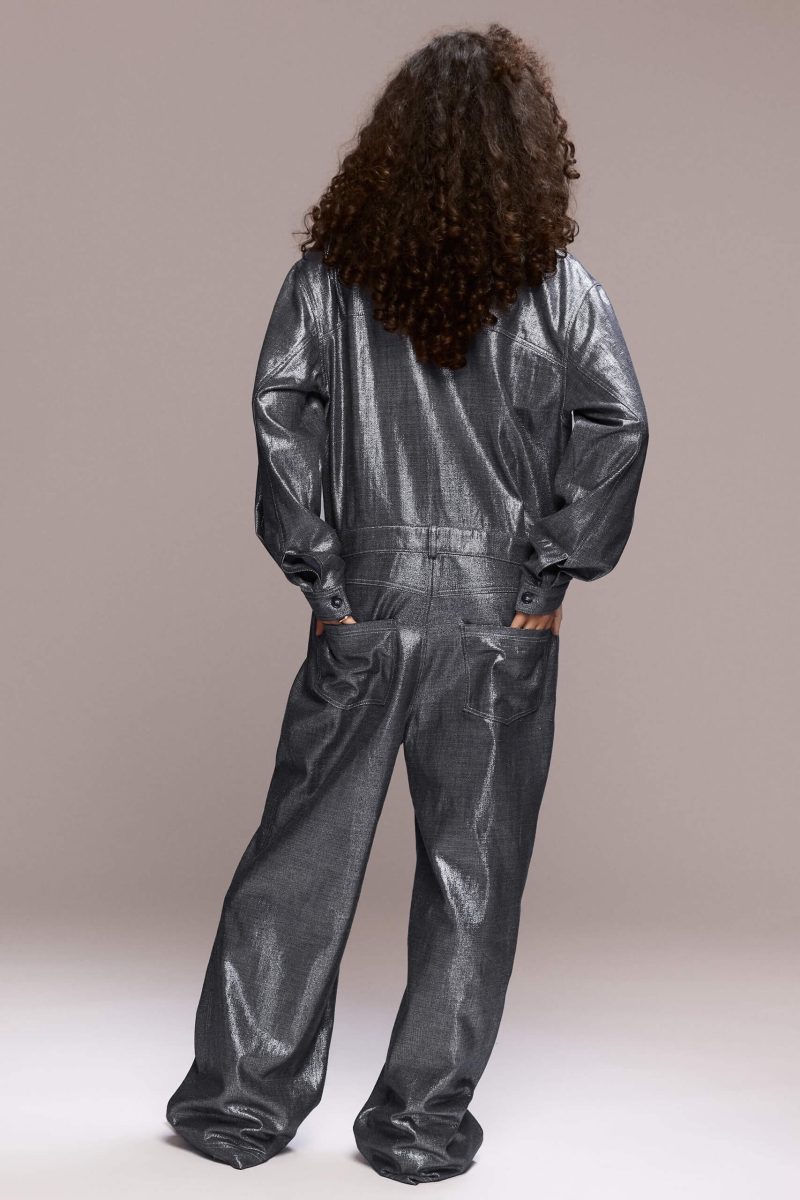 The silver metallic boilersuit offers a bold, fashion-forward statement. Its relaxed, oversized fit with a collared top and front button closure, straight-leg makes it perfect for a night out, a festival or any event where you want to stand out, being both eye-catching and comfortable.