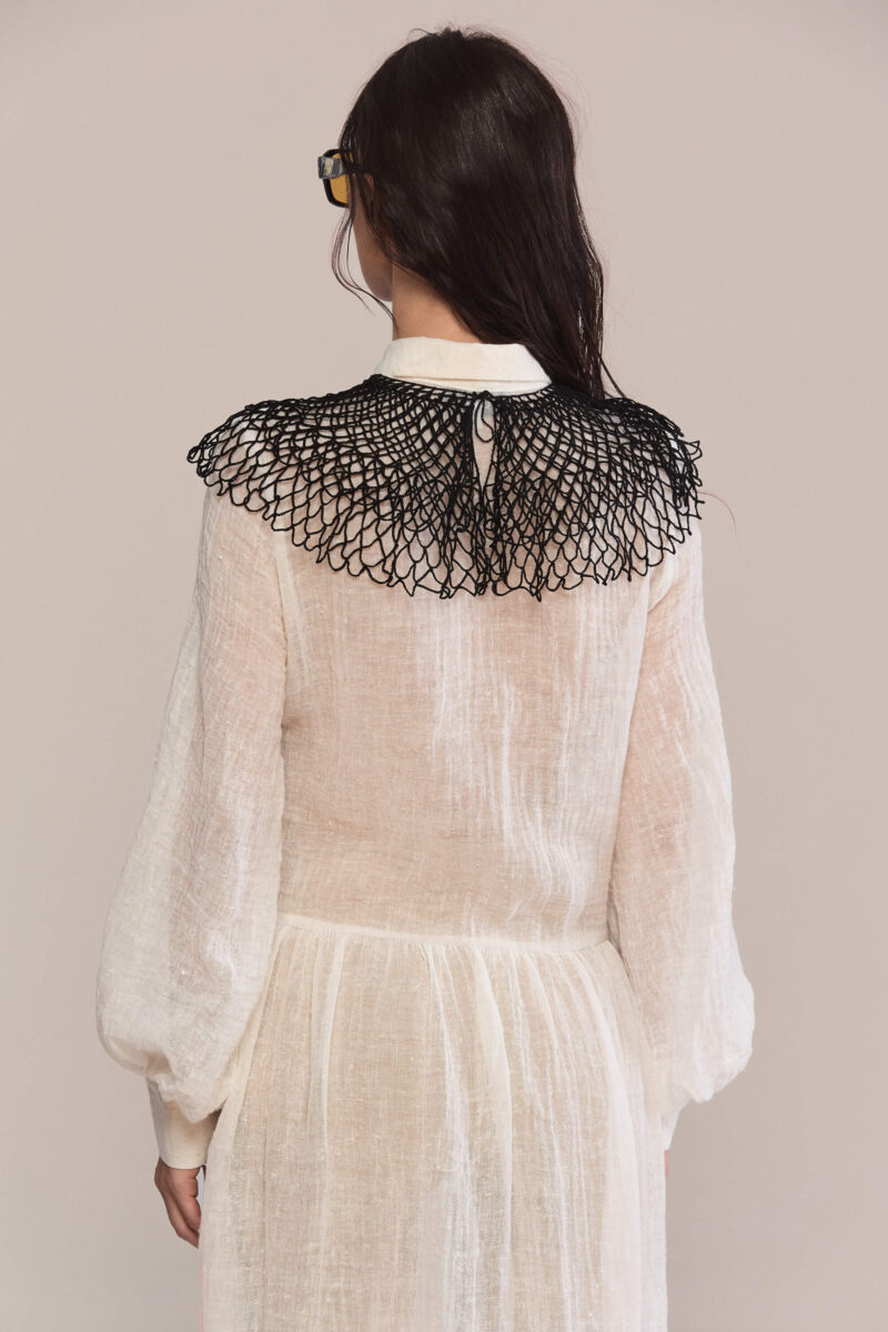 Exude timeless charm in this semi-sheer maxi long dress, featuring a delicate handmade collar. Crafted from lightweight linen, it flows into a breezy silhouette for effortless elegance and a captivating presence.