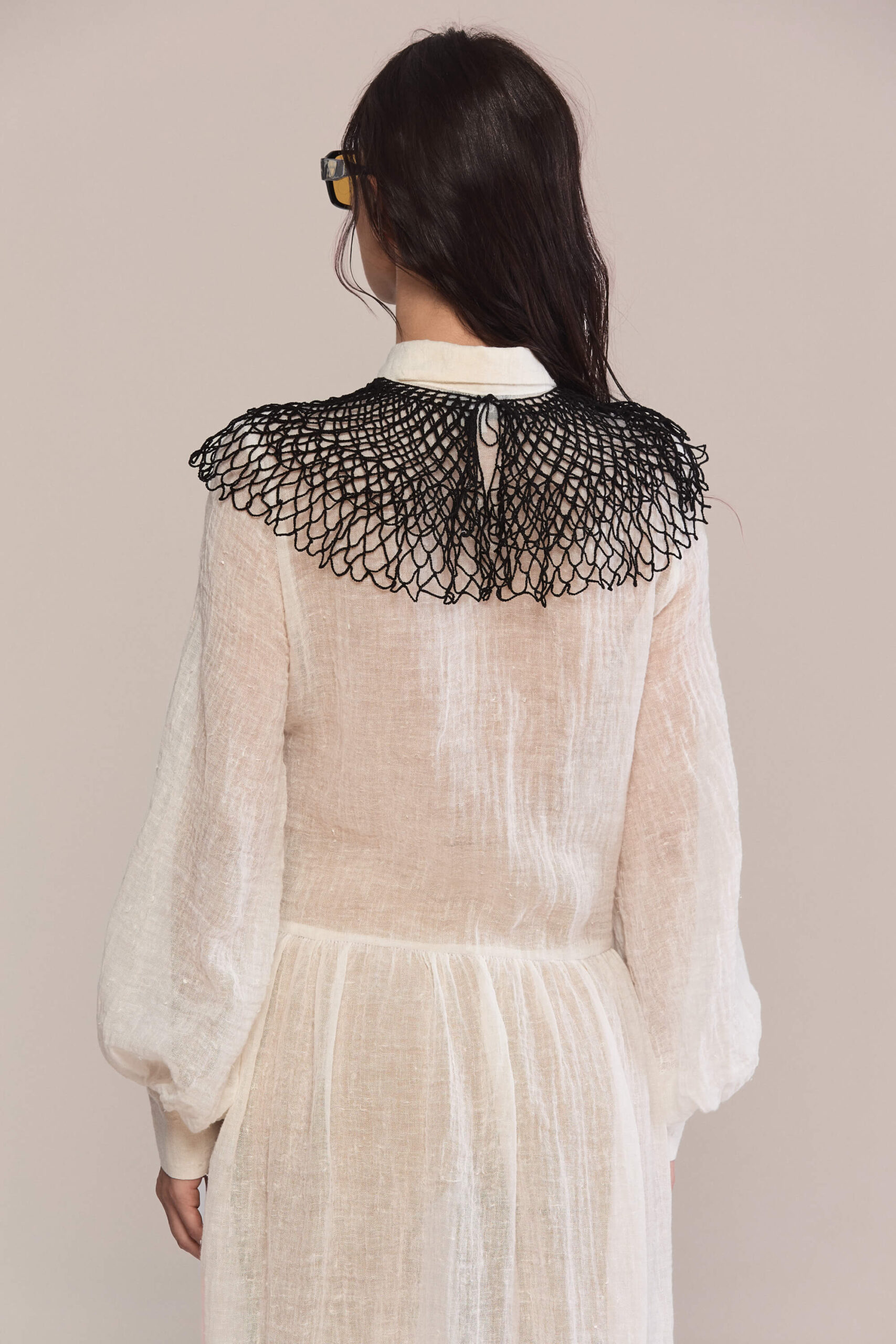 Exude timeless charm in this semi-sheer maxi long dress, featuring a delicate handmade collar. Crafted from lightweight linen, it flows into a breezy silhouette for effortless elegance and a captivating presence.