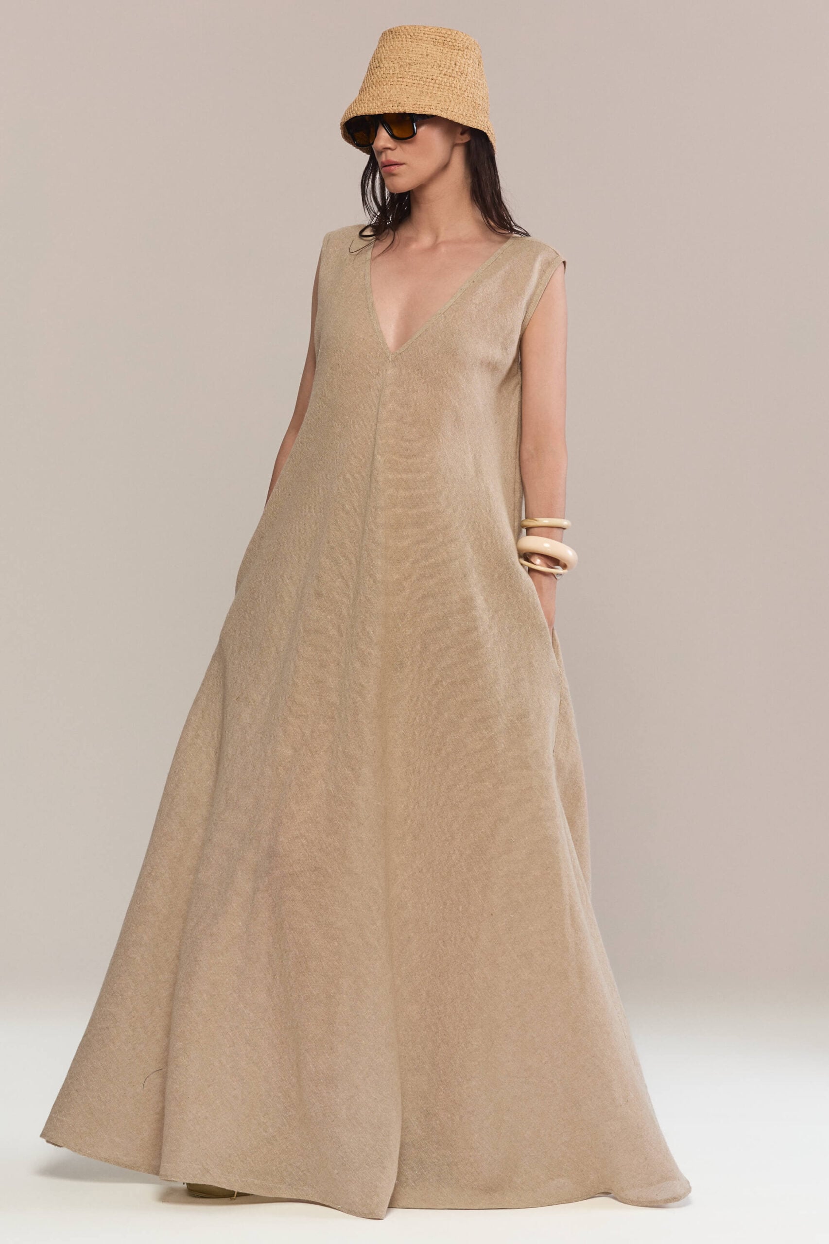 With a relaxed, floor-length cut that provides comfort and effortless elegance, this hemp dress is both versatile and chic, suitable for a variety of occasions for casual outings to more formal events.