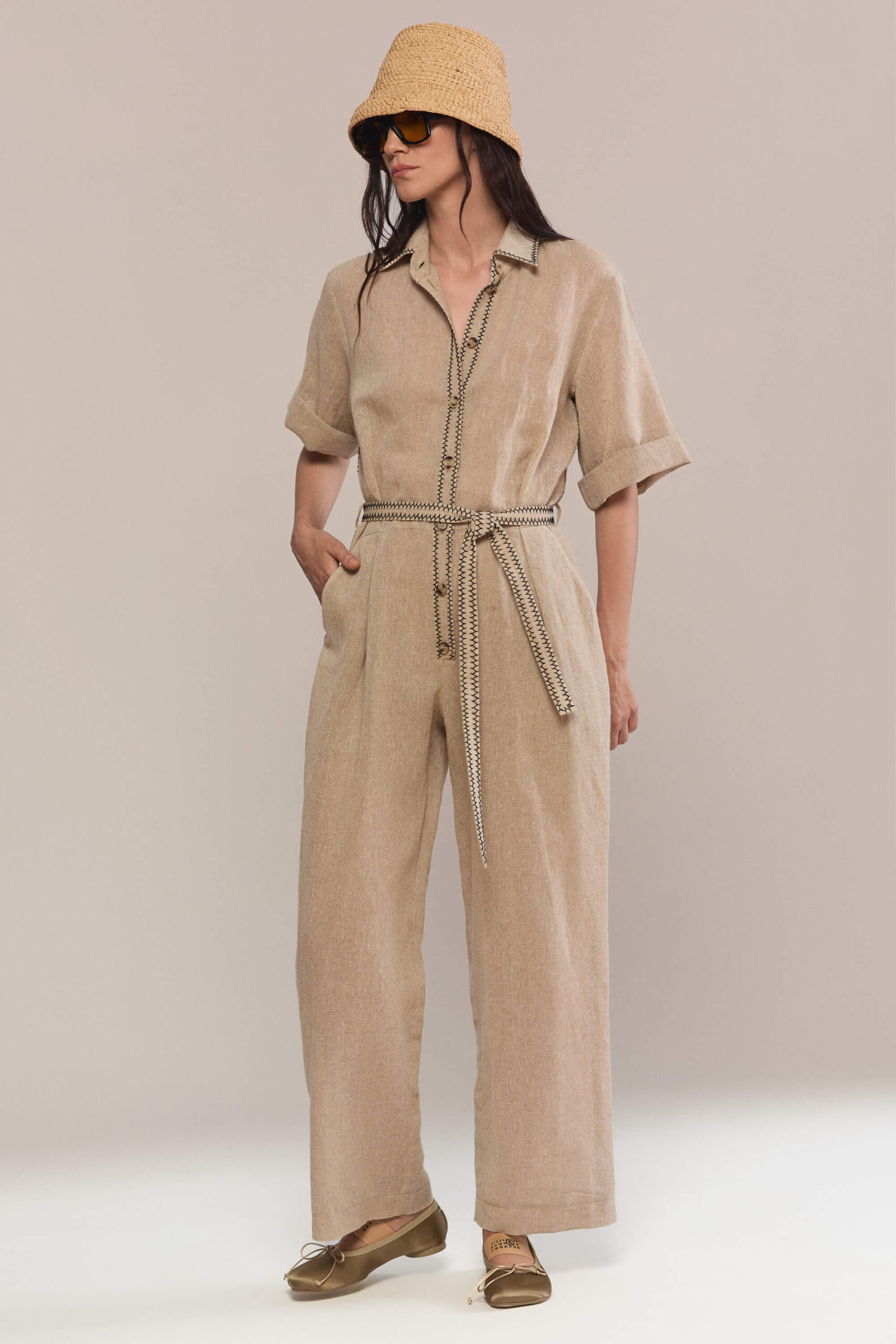 Designed with a relaxed wide-leg silhouette and a classic button-front collar, our hand stitched jumpsuit offers an elegant yet breathable look. Hand-stitched seams and the belt define the waist with a feminine touch.